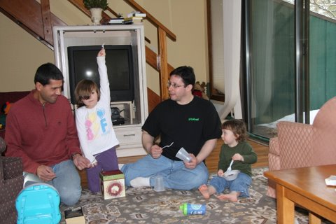 HolidayBand.jpg - Hannah conducts a 4 person plastic fork band.