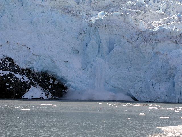 P6210145.JPG - This is a photo of a glacier calving. In other words, a big chunck of ice breaking off and falling into the ocean.