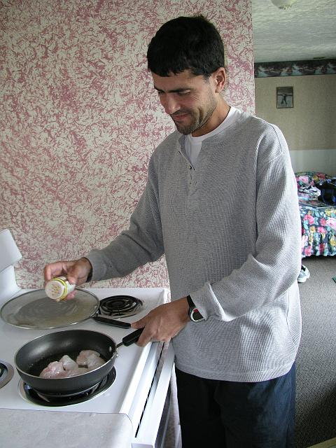 P6230174.JPG - Paul cooking up the halibut cheeks from the fish he caught that morning. You don't get much fresher than that!