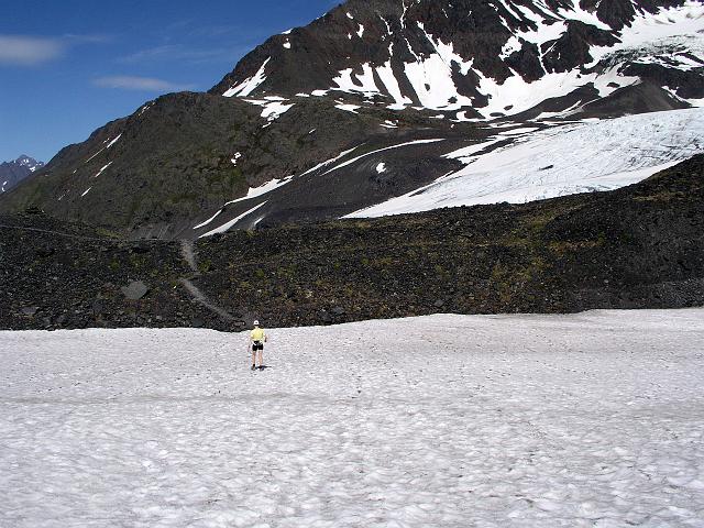P6240197.JPG - Joyce trekking through the snow. It did get rather chilly and windy this close to the glacier.