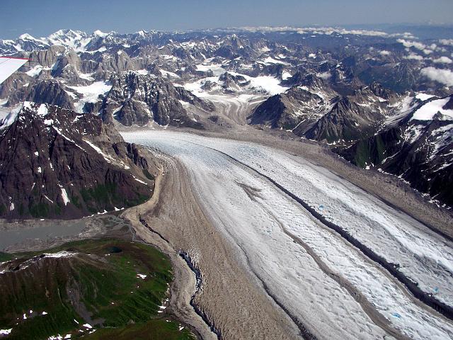 P6250213.JPG - A view from above of a glacier surrounded by mountains.