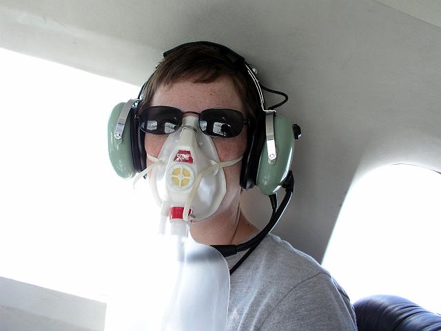P6250214.JPG - Because we flew at a high altitude in a unpressurized aircraft, we had to wear oxygen masks for part of the flight.