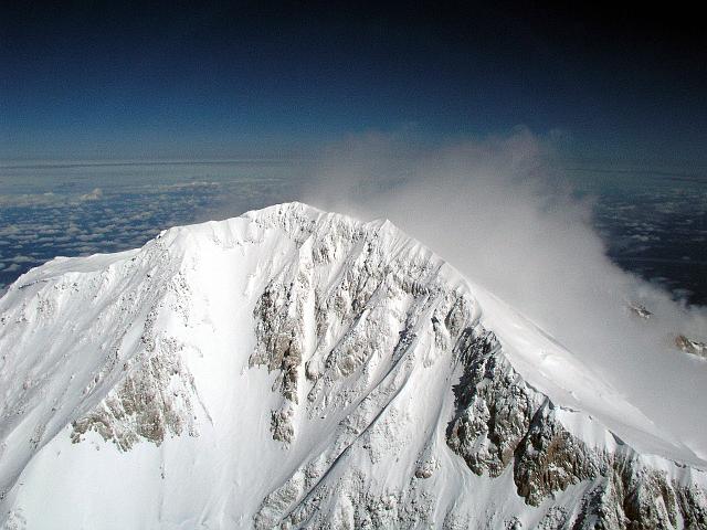 P6250223.JPG - HIgh winds blowing snow off the summit. Winds at the top were about 50 kts... no one's going to bag this peak today!