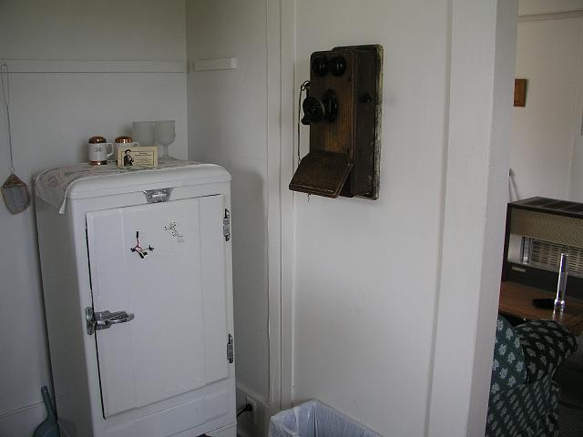 P1012115.JPG - An original Frigidair, ancient telelphone, and antique fly swatter give our cabin a historical feel.