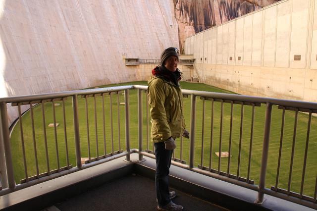 IMG_4404.JPG - Joyce at base of Glen Canyon dam. The green field is the size of 2 football fields.