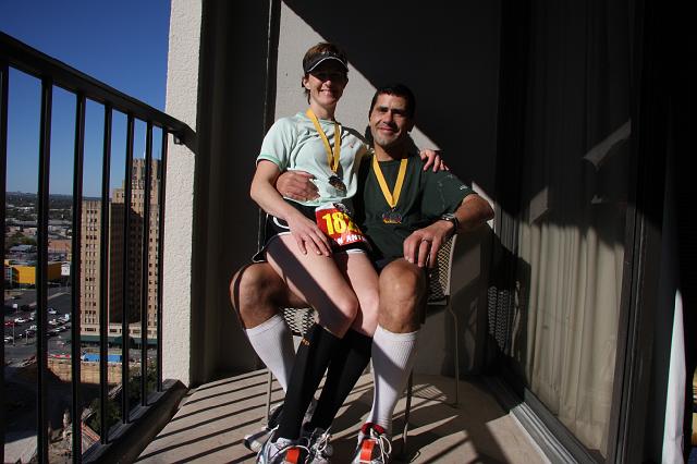 IMG_0634.jpg - Joyce and Paul showing off their marathon medals and compression socks.